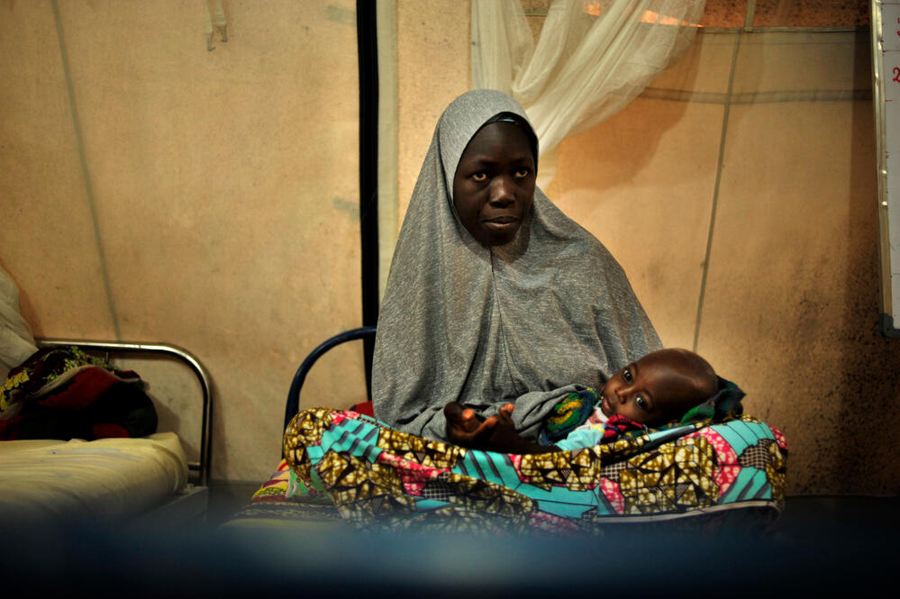A mother stays with her baby while she recovers in MSF's hospital in Fori, Nigeria.