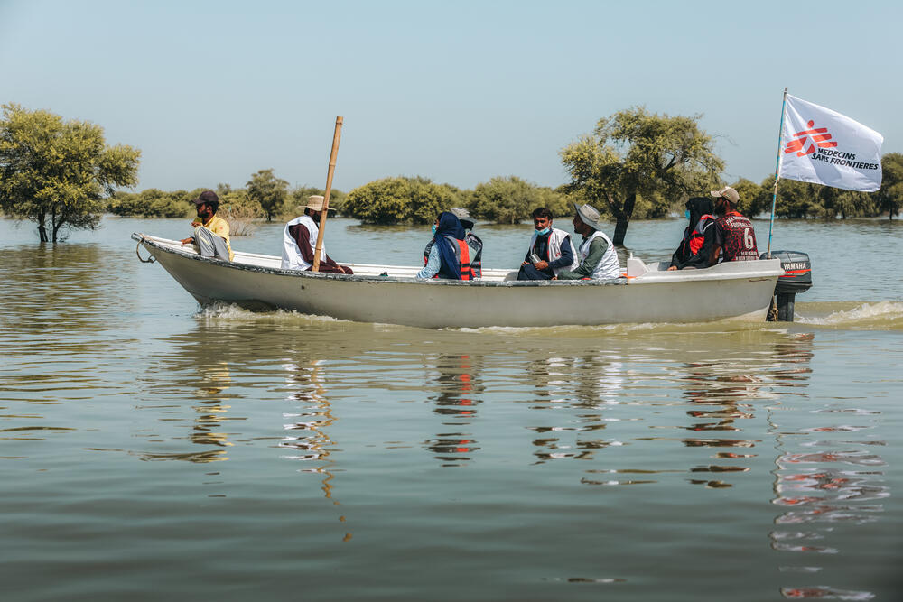 An MSF medical team travelling by boat to run mobile clinic in Johi town, Sindh