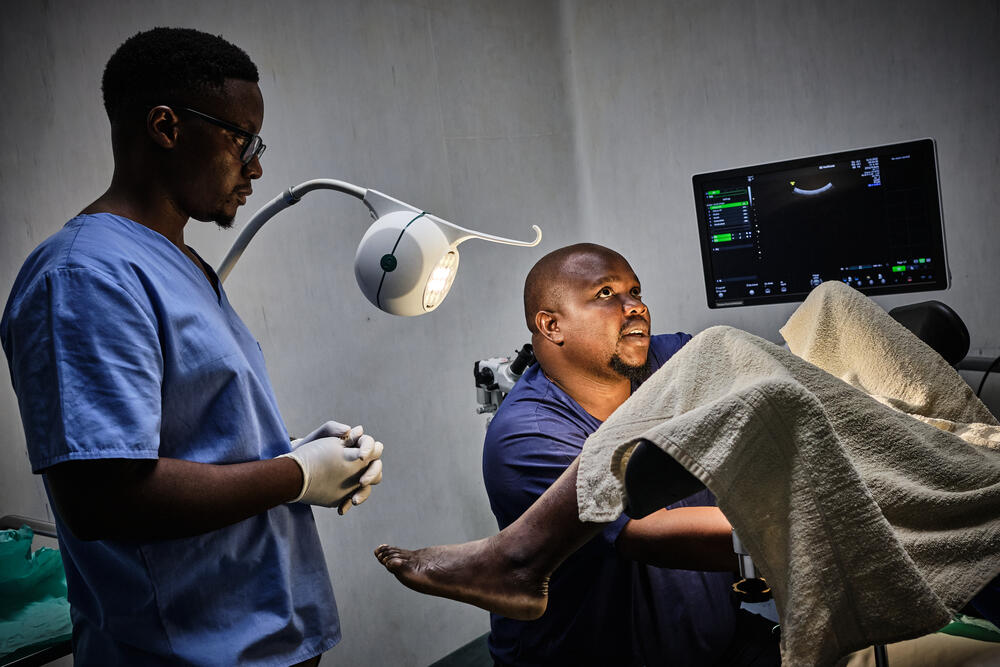 Gynecologist George Chilinda performs a biopsy on a patient suspected of cervical cancer at Queen Elizabeth Central Hospital in Blantyre, Malawi. 