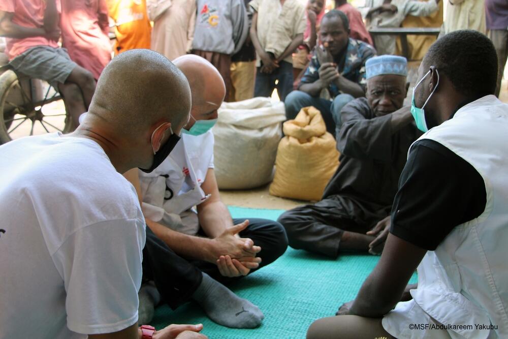 MSF team in talks with a local bulama (community leader) about the 'test and treat' outreach activity covering children in Bolori neighborhood in Maiduguri.