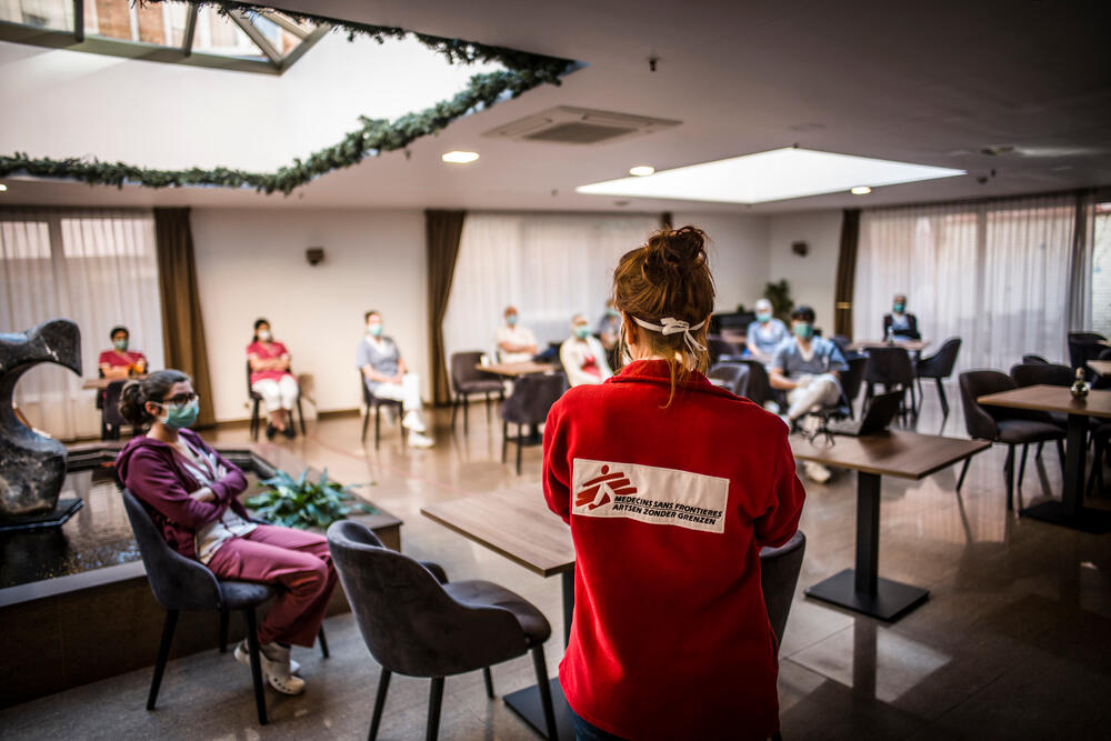 A mobile team from MSF gives a briefing to the staff of the retirement home "Résidence Christalain", in Jette, Brussels.