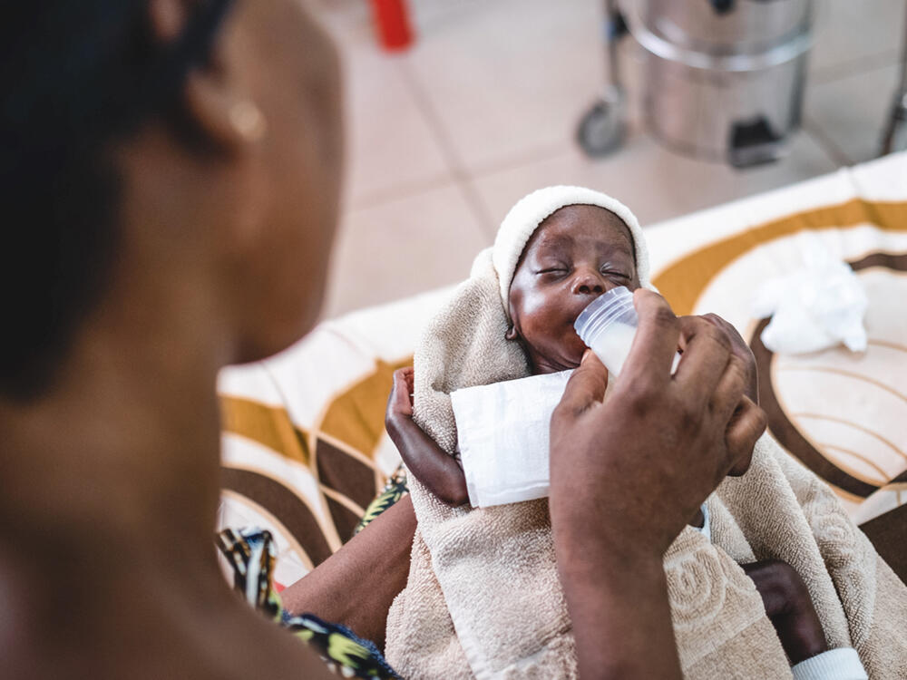 Stephanie feeds Archange after he spent 45 days in neonatal intensive care