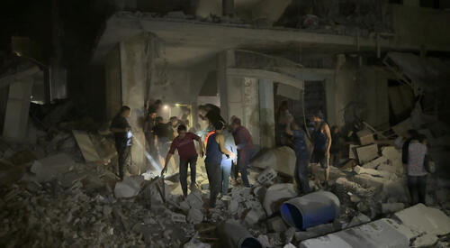 Community members searching for dead and wounded people following an airstrike in Northern Gaza