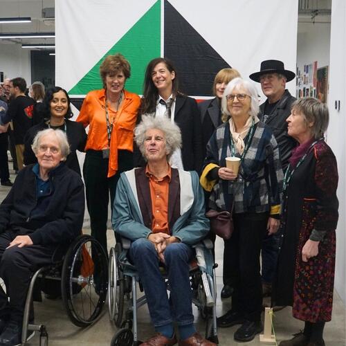 Supporters pose at the 'Artist Fundraiser' event in early December