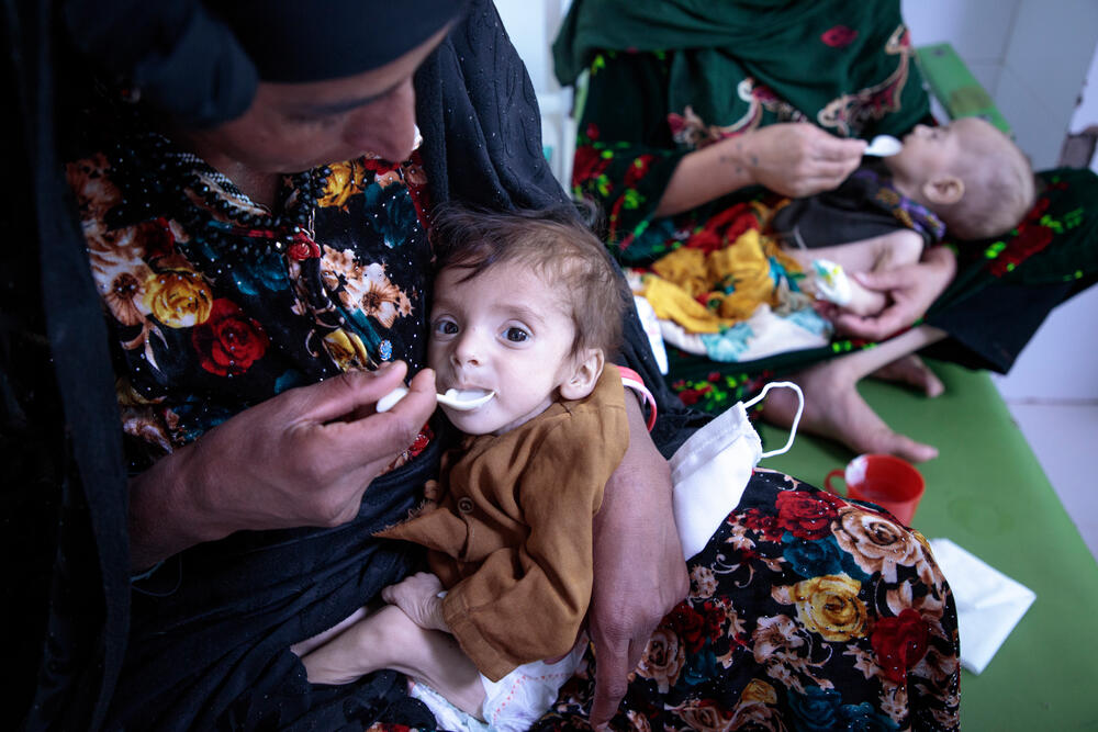 Mothers feeding their children at an MSF centre treating malnourished infants in Herat
