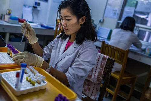  Laboratory technicians work on serum examinations at MSF’s Insein clinic in Mayanmar