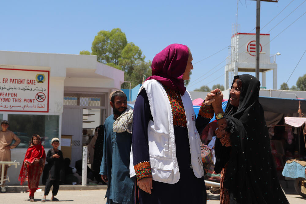 Local people greet MSF staff outside Boost Hospital in Afghanistan
