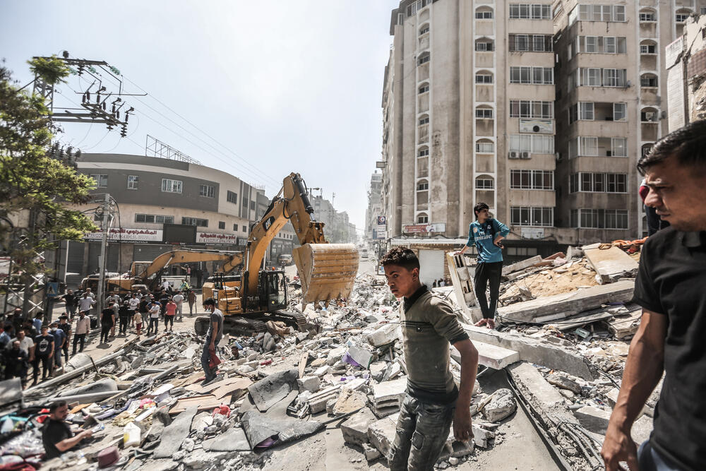 Debris being cleared after an airstrike destroyed a residential tower block in Gaza City