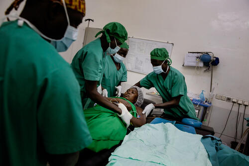 France is brought to the recovery room after a surgical procedure to get her wound stitched on 19 January 2021, at MSF's SICA Hospital. 

France Beldo, 31, was wounded on 13 January 2021 during the clash between rebel groups and the national forces supported by their international allies, on the outskirts of Bangui, the capital of the Central African Republic. While at home in Damala neighbourhood, close to the fighting , a stray bullet hit her hand, chest and shoulder, without damaging an important organ.

"I was wondering if I would survive or not. It is only when I arrived here that the doctors told me: it is going to be fine," she recalls. "I can see their work that made me heal."