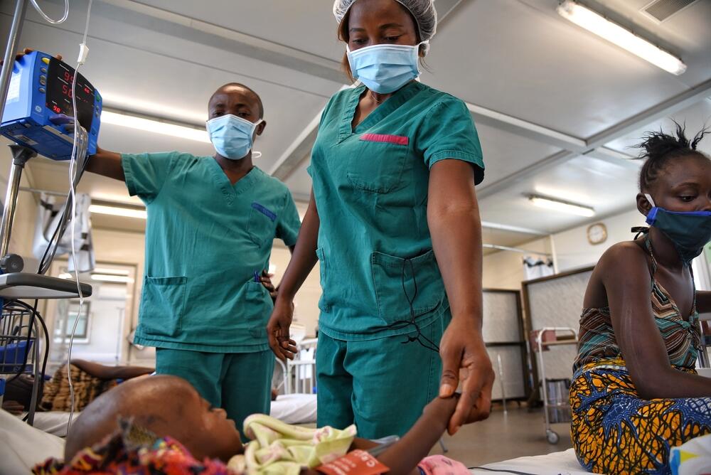 MSF nurse Ruth Gbassa checks on a baby in the intensive care unit at Hangha hospital in Sierra Leone