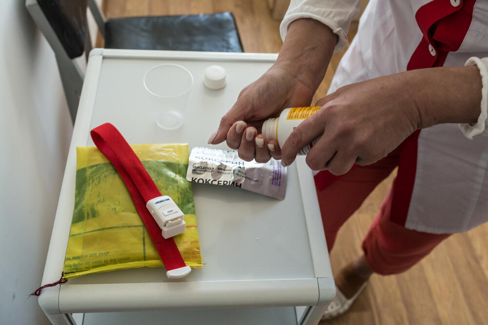 A nurse prepares pills for an MDR-TB patient at a facility in the Novograd-Volynsk district of Zhytomyr