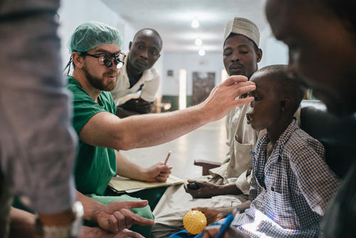 Adamu, a 14-year-old from Kebbi State, meets MSF's specialist team during a screening session at Sokoto Noma Hospital
