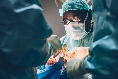 Dr Muhammad Abubakar Lawal, plastic surgeon, is operating at the Noma Hospital in Sokoto, Nigeria. Four times a year, a team of highly trained plastic and maxillofacial surgeons, anaesthesiologists and nurses performs life-changing reconstructive surgery for noma survivors. Inside the operating theatre, the team spends several hours operating on the more complicated cases. The noma surgical intervention in May 2023 was led by an all-Nigerian team. May 10, 2023.