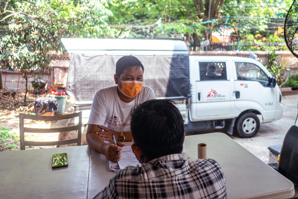 An HIV/hepatitis C patient receives a consultation in MSF's Yangon office, now used as a makeshift clinic