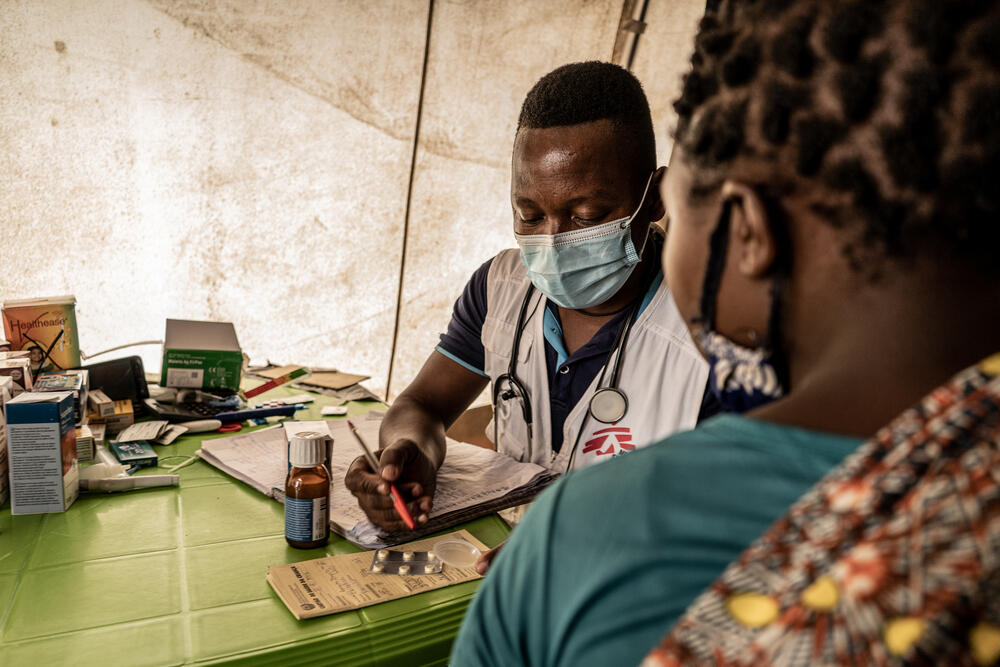 Doctor Nazario Jaime consults with a patient living in the Nicuapa displacement camp in Cabo Delgado province.