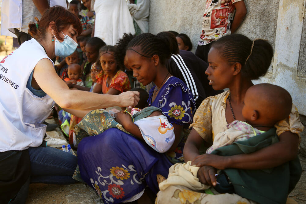 An MSF nurse checks a child for signs of malnutrition at a mobile clinic in the village of Adiftaw, Tigray.