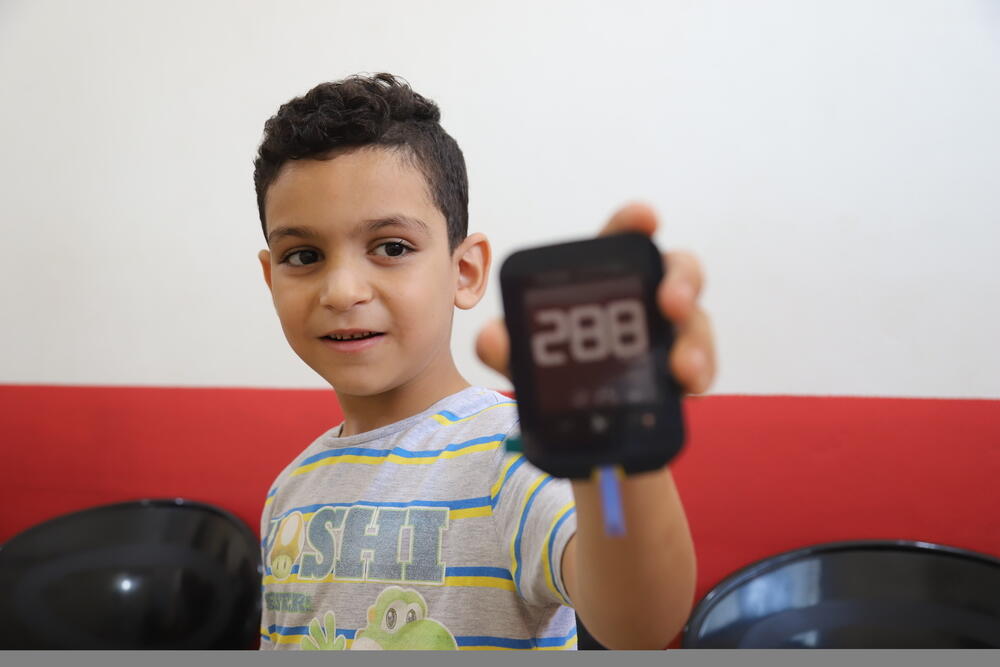 Eight-year-old Abdallah receives treatment for diabetes at the MSF clinic in Shatila refugee camp, Lebanon, where he is provided with insulin pens