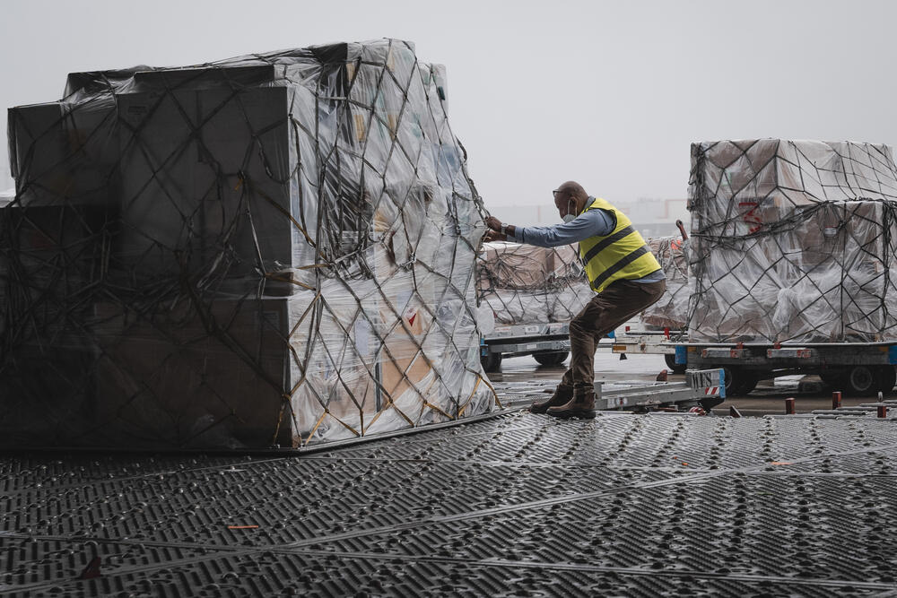 Medical supplies, including tents and emergency water supply systems, are loaded onto a cargo plane in Brussels, destined for Ha