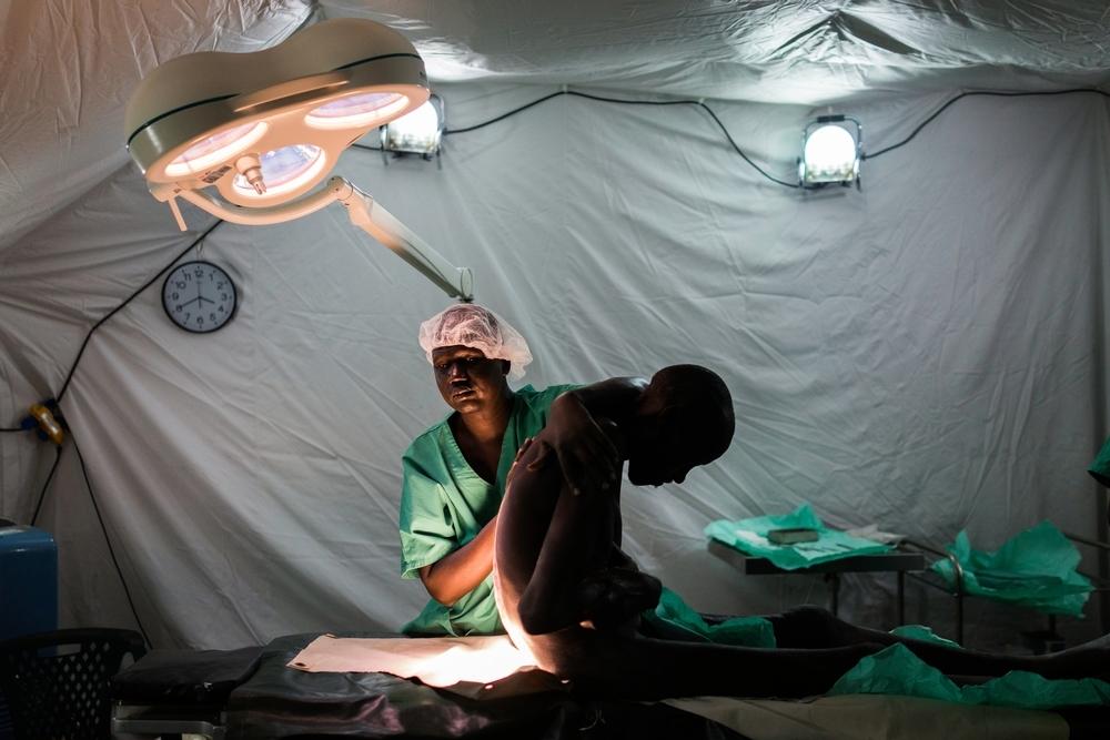 An MSF medic prepares a 60-year-old man for surgery in the MSF hospital in Lankien. November 2015.