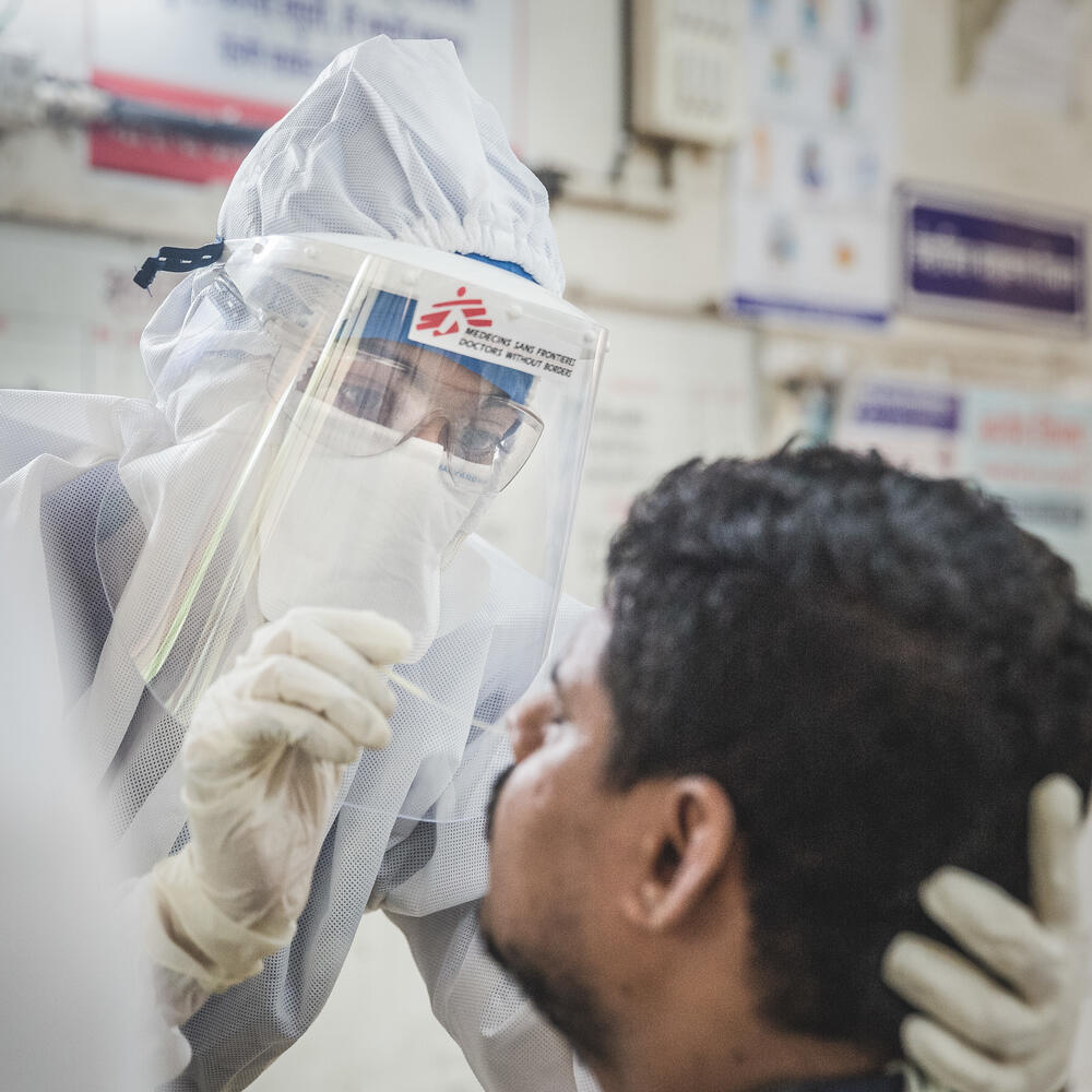 An MSF doctor taking a swap sample of a patient with suspected COVID-19 at a healthcare centre in Mumbai