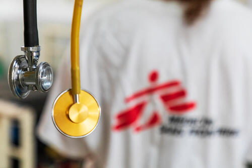 Stethoscopes hanging in front of an MSF medic