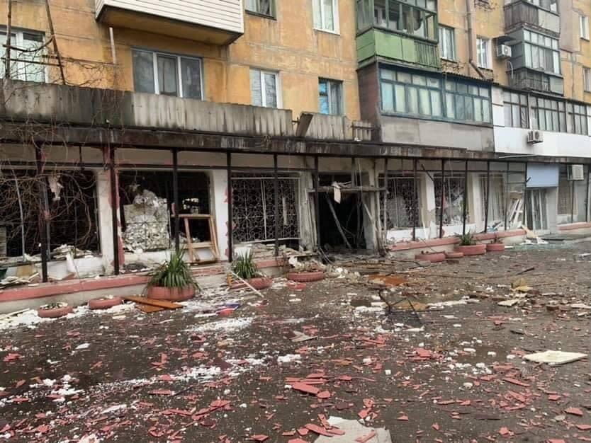 Damaged buildings along a street in Mariupol, Ukraine