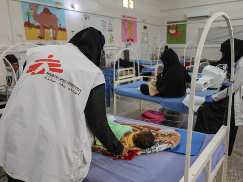 An MSF nurse follows up on a 6-month-old boy being treated for malnutrition at the MSF-supported Abs General Hospital in Yemen