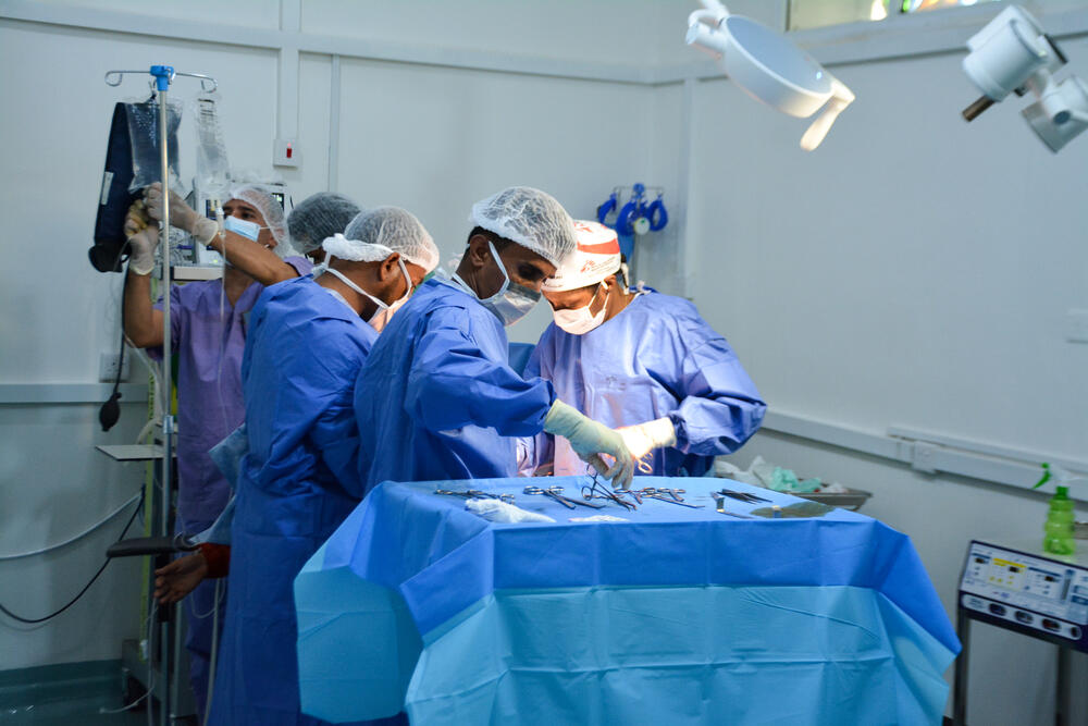 An MSF surgical team performing a caesarean section in the operating theatre at Al-Qanawis Hospital