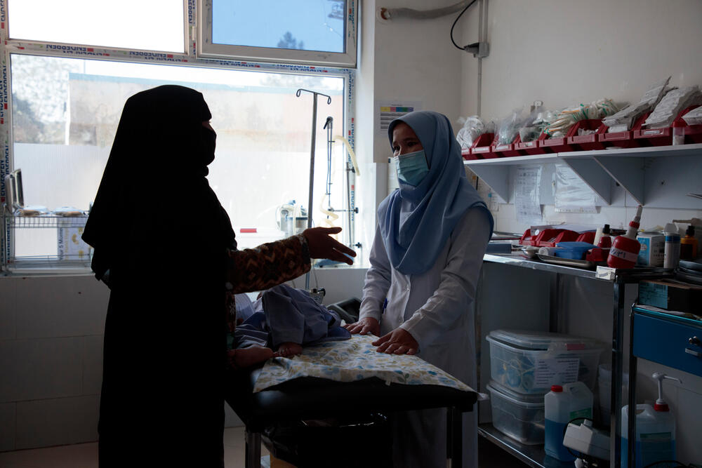 A mother speaks to a nurse at MSF's inpatient feeding centre in Herat.  