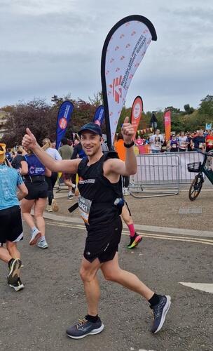 Running with an MSF banner at the Royal Parks Half Marathon in October