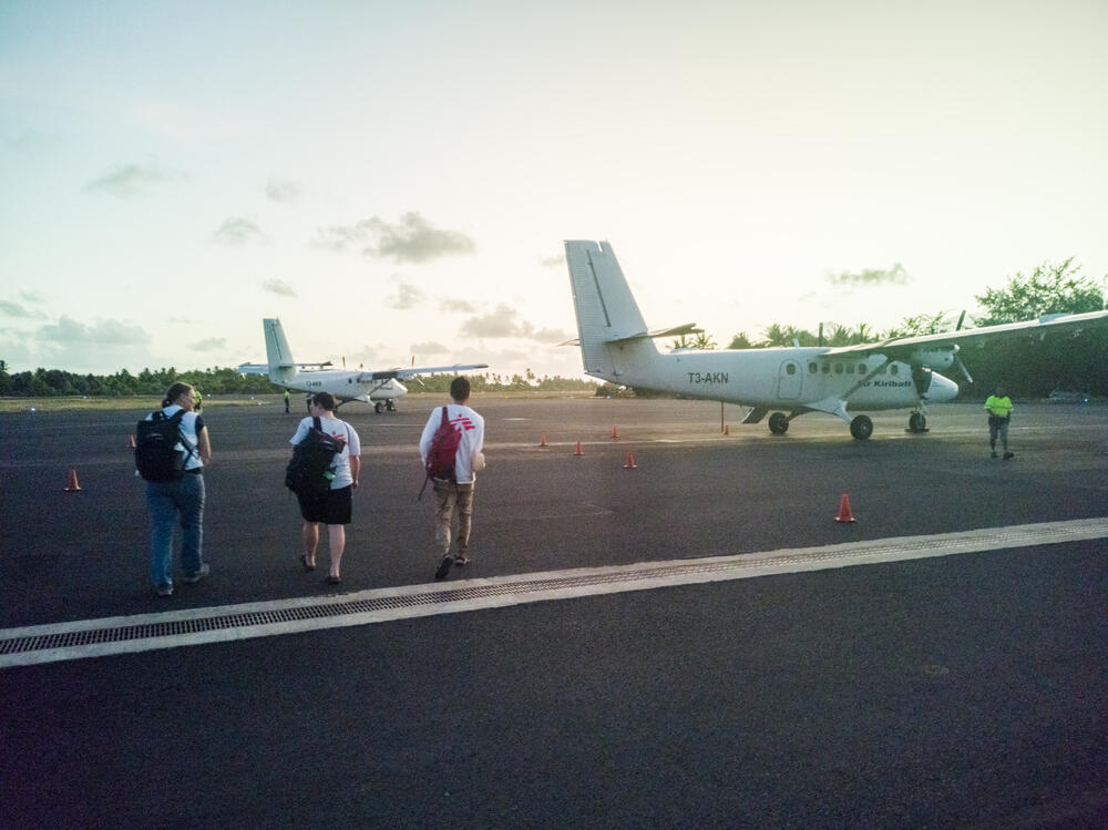 An MSF team boards a plane in Tarawa, travelling to the outer islands to support Ministry of Health medical services