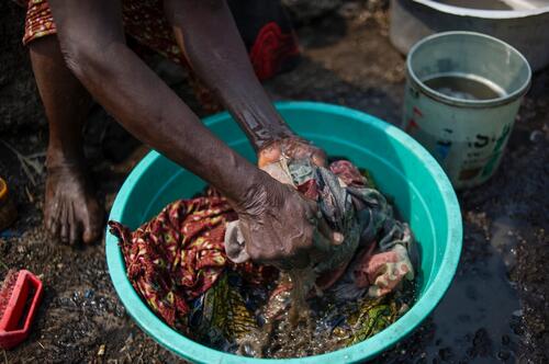 Jaqueline, 72, in Bulengo IDP camp near Goma, North Kivu: She lives here with two of her grandchildren - their parents were killed in the late 2000s, near Bukavu. She has an injured leg and spine when she fell from a bridge near Bukavu. 

'It's very difficult to live here. We haven+t received any help at all. We have nothing. People spend the whole day searching for vegetables. If someone takes pity on us, they can give us a bit of 'fou-fou' or some beans. My grandchildren were sent away from school because we have no money for the school fees. We don't even have money for soap, to wash clothes. It's only if someone gives us a few francs that we can buy some soap. I can't cultivate with my injuries, I can't even carry a jerrycan of water...