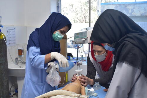 A team of MSF nurses perform CPR on a critically ill young child at Herat Regional Hospital, December 2020