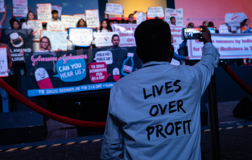 The moment protesters take over the stage during the official opening ceremony of the 50th Union Conference on Lung Health to demand fairer pricing for tuberculosis treatments.