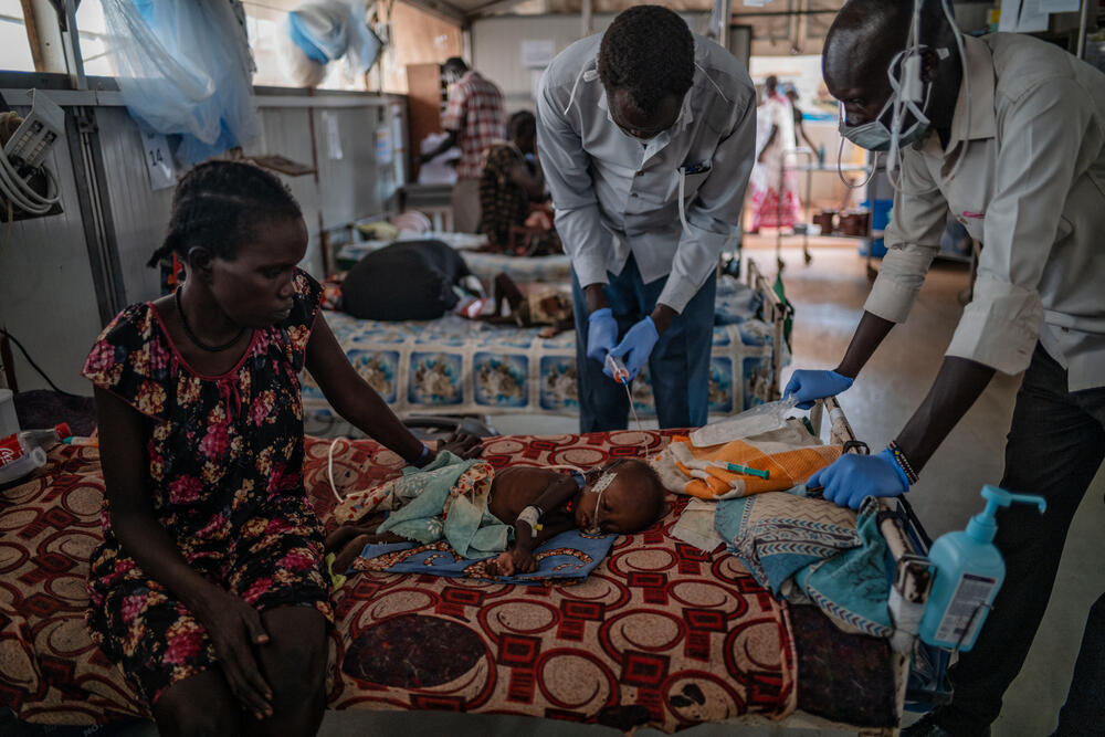 MSF medics check-up on a young child being treated for malnutrition at the hospital in Bentiu camp