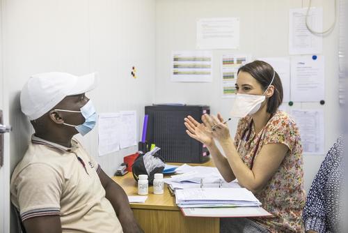 Dr Louisa Dunn, an investigator on the TB PRACTECAL clinical trial, consults with a patient.