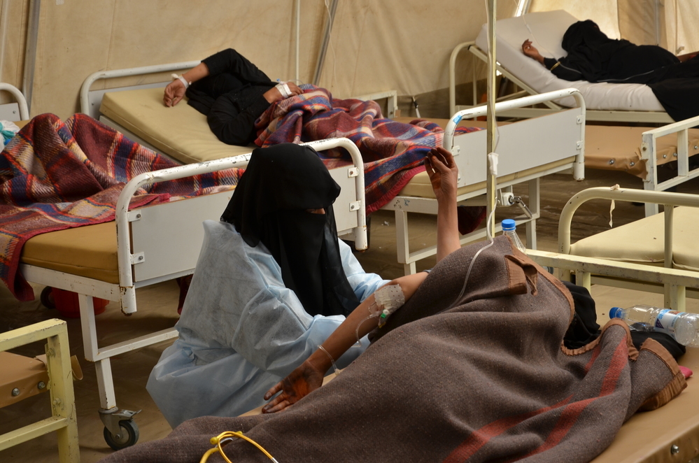 An MSF nurse checks a woman's blood pressure in the cholera treatment centre in Yemen. 