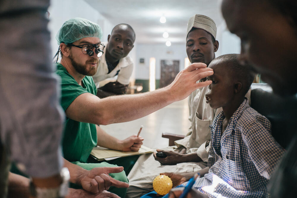 An MSF surgical team plan a skin graft operation for a 14-year-old noma patient at Sokoto Noma Hospital in Nigeria