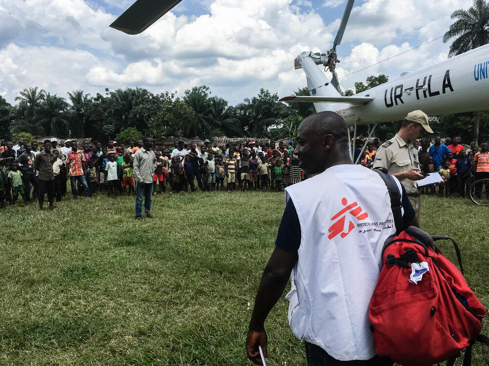 Logistical supplies are unloaded from a helicopter in the remote area of Itipo