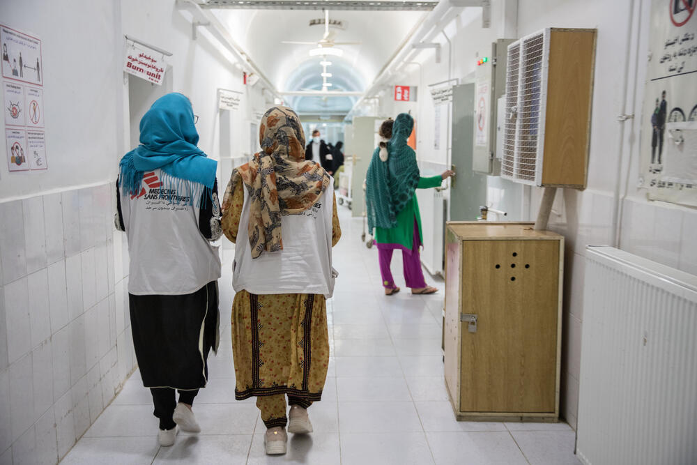 MSF staff walk down the corridor of the female inpatient department at Boost hospital, Lashkar Gah