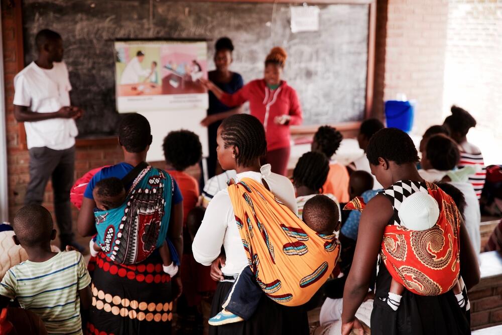 An MSF health education session taking place while women wait for cervical cancer screening in Malawi