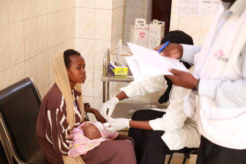 A young mother with her baby in Nyala Teaching Hospital