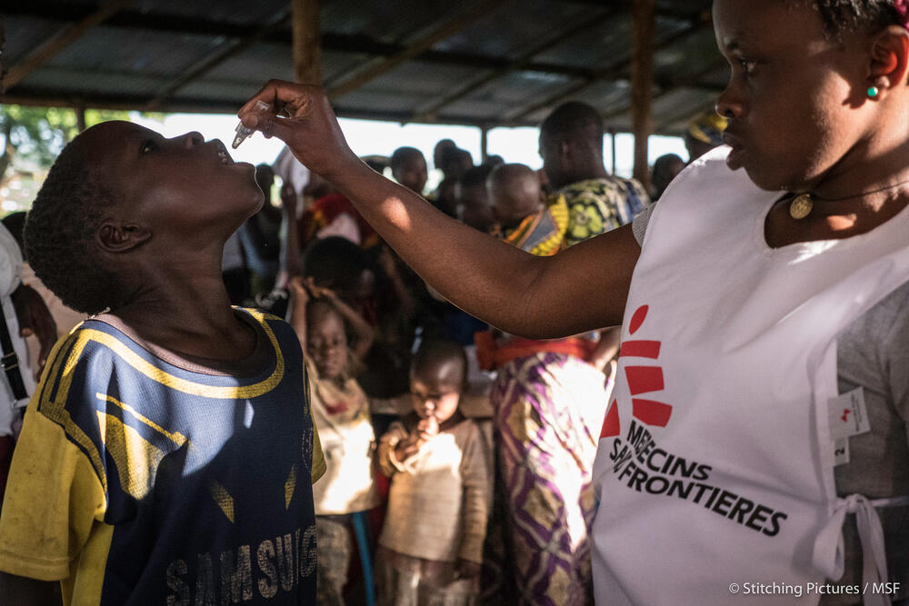 Refugees are vaccinated against cholera at a camp in Uganda, May 2018