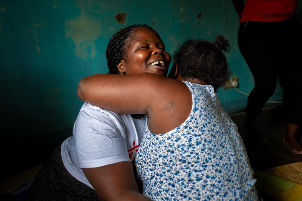 A sex worker hugs MSF nurse mentor Chrissie Nasiyo during an outreach clinic conducted for a group of sex workers in Nsanje, Malawi, 2019. 