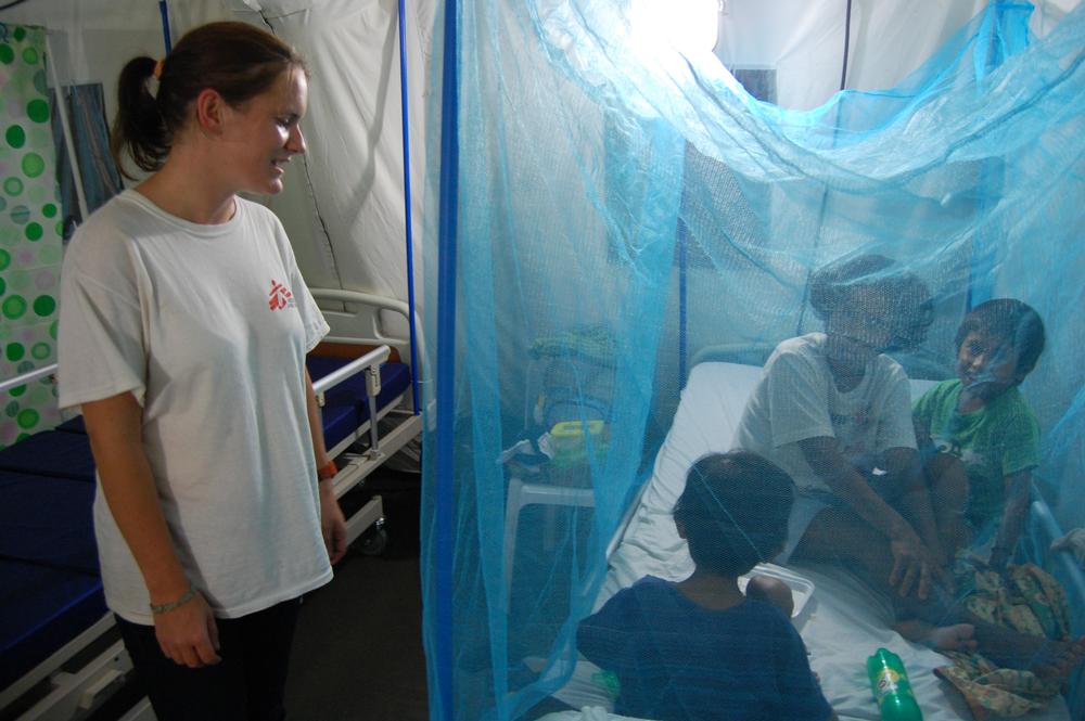 Natalie speaks to a patient during one of her early MSF assignments to the Philippines in response to Typhoon Haiyan, 2014.