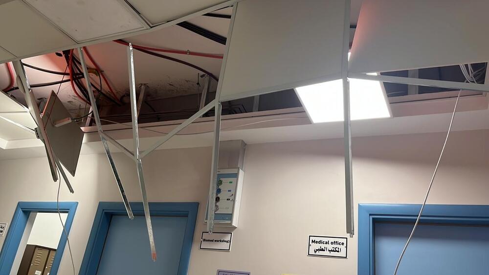 A partially collapsed ceiling at Al-Awda Hospital, sustained during airstrikes - 11 October