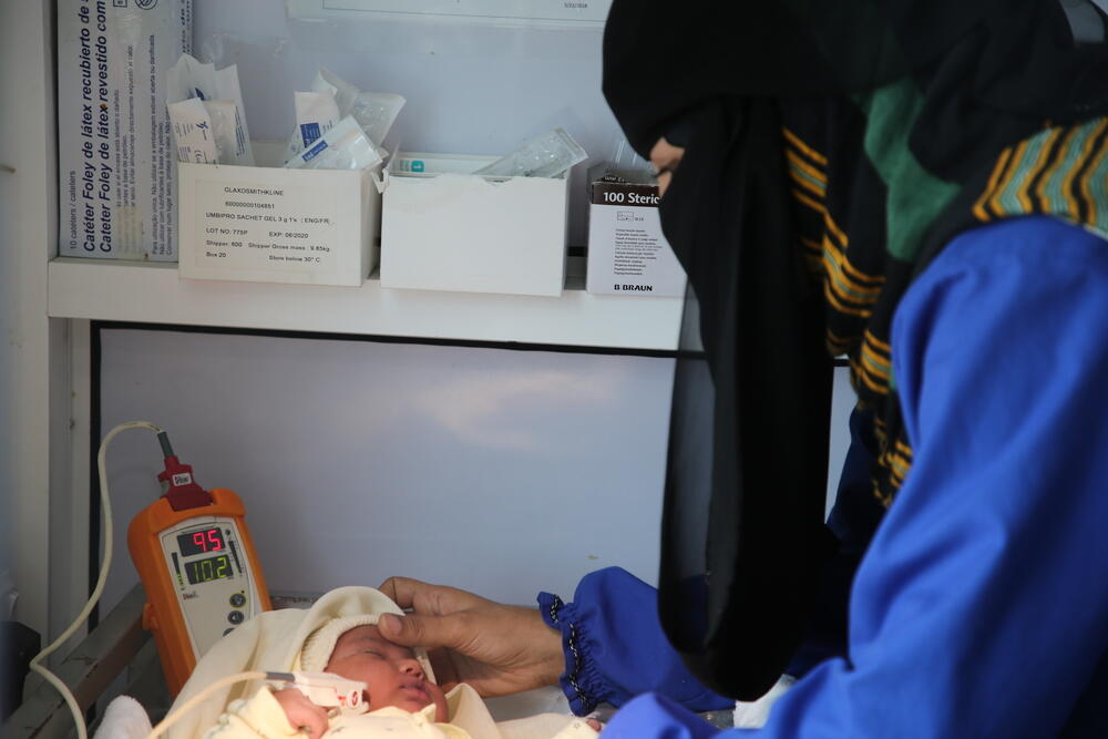 Midwife Wadha checks on a newborn at MSF's Mother and Child Hospital in Taiz