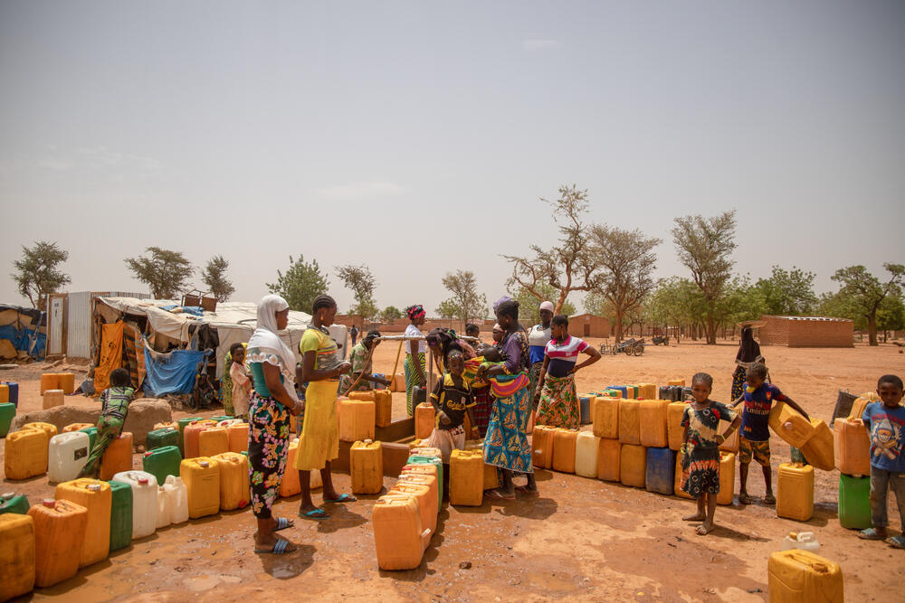 Families waiting to collect clean drinking water at a borehole rehabilitated by MSF in Kongoussi, Burkina Faso