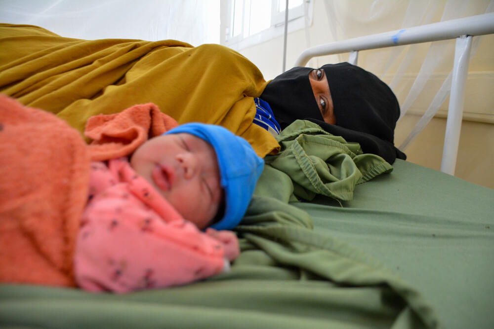 New mother Zaima Hussain and her baby, Aiesha, rest in the post-operative ward of the mother and child hospital