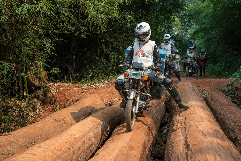 Measles vaccines being transported by motorbike from to Boso Manzi, a hard-to-reach area of Northern DRC badly hit by the measles epidemic